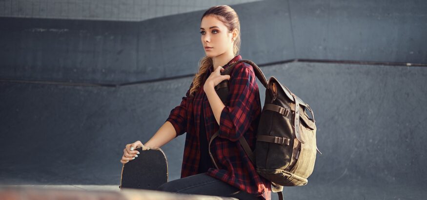 a-student-girl-with-a-backpack-wearing-a-checkered